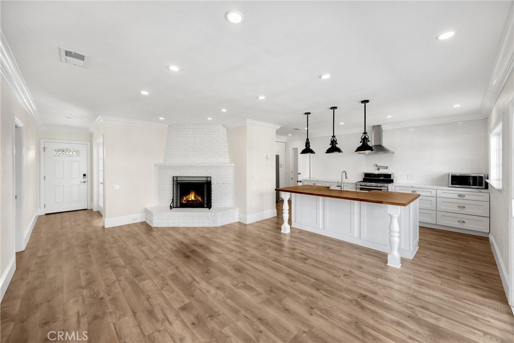 Welcome to this beautifully updated 3-bedroom, 2.25-bathroom home, ideally situated on a quiet cul-de-sac in one of Glendora’s most desirable neighborhoods. This charming single-story home offers 1,591 sq ft of well-appointed living space on a generous 10,744 sq ft lot.
Originally built in 1956, the home blends timeless character with modern upgrades, including fresh exterior paint (completed this month), luxury vinyl plank flooring throughout, a remodeled kitchen with stainless steel appliances, and updated bathrooms with contemporary finishes. Recent system updates include a newer HVAC and water heater, dual paned windows, along with leased solar panels (on a metal roof) for energy efficiency and reduced utility costs.
Step outside to the expansive backyard—an ideal space for entertaining, gardening, or relaxing. A versatile shed adds even more potential, perfect for storage, a workshop, gym, or creative retreat. There is even potential for RV parking!
Located just minutes from the charming Glendora Village, nearby parks, and convenient freeway access, this home offers the perfect blend of comfort, style, and location.
Don’t miss this opportunity to own a move-in ready home with curb appeal, modern amenities, and room to grow!
