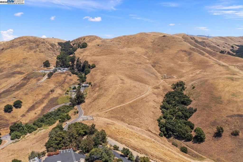 Unique opportunity for 105 acre ranch property with custom homesite high in the hills in desirable Mission San Jose High School attendance area for Chadbourne Elementary, Hopkins Middle and Mission San Jose High Schools. Property consists of 4 parcels totaling 105.02 Acres. Homesite is on APN 513-160-1-17 (3.58 acres) which currently has 2 homes: 42300 is a 5 bedroom, 3 bath, 2,500sf mobile home built in 1974, 42290 is a 3 bedroom, 2 bath, 1,675sf modular home built in 1980, plus a swimming pool. Site is served by PG&E. Each home has a septic system. Site will require new well after COE (see ACWD notice). Two parcels (1-18 and 1-14) totaling 100.75 acres are subject to Williamson Act Contract. Property is zoned Open Space - Hill Face. New home will require a conditional use permit. Special financing for purchase and construction is available.