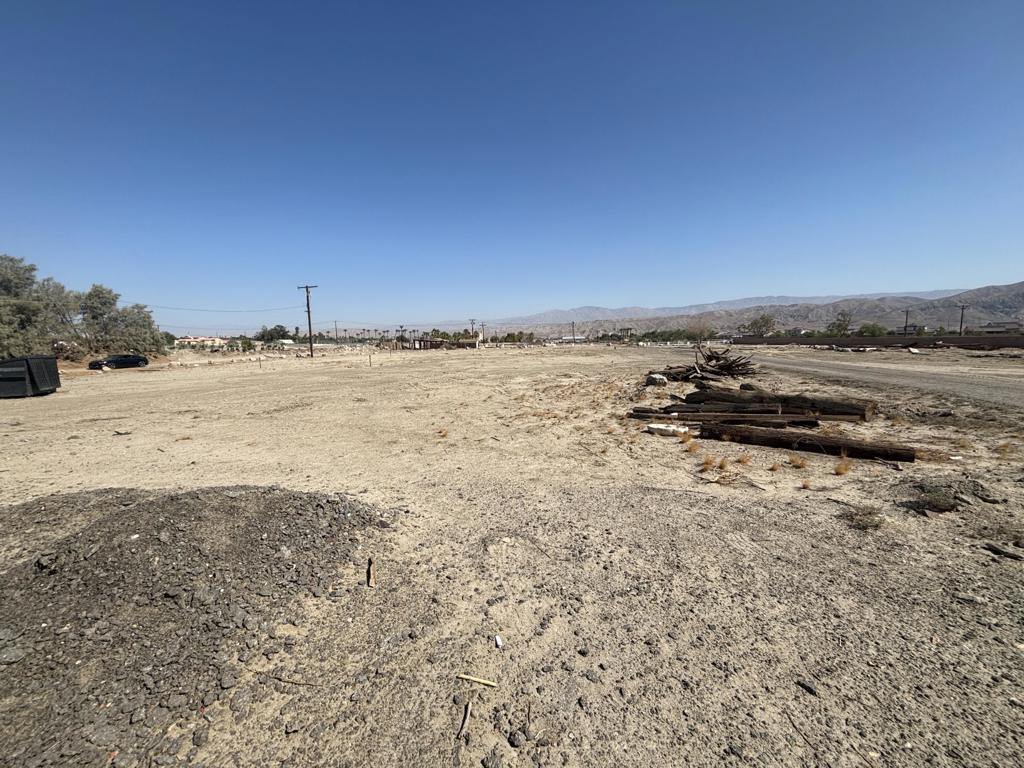 Rare opportunity to own a highly versatile 2.5-acre property in Indio with endless potential. This flat, usable lot offers excellent access for heavy equipment, trucks, and large vehicles, making it an ideal setup for landscaping companies, construction businesses, or any operation needing space for machinery and storage. It's also a perfect blank canvas to build your dream home or custom estate, with plenty of room for additional structures, RV parking, or agricultural use. The property is zoned for flexible use (buyer to verify with county) and utilities are nearby, providing a solid foundation for future development. The location is private and peaceful, yet just minutes away from shopping, dining, schools, and major roadways--offering the best of both convenience and seclusion. Seller is willing to carry paper with negotiable terms, creating a unique opportunity for buyers seeking flexible financing. Don't miss your chance to invest in one of Indio's fastest-growing areas with space, privacy, and unlimited possibilities.