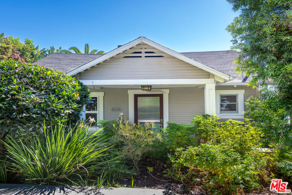 A Hidden Sanctuary in the Heart of Silver Lake - Tucked behind a private gated driveway, this charming Craftsman's home offers a rare blend of privacy, natural beauty, and city views. Step onto the welcoming front porch and into a bright, open-concept living area that feels instantly serene. The spacious living room flows seamlessly into the kitchen, where you'll find a bar-style dining area, generous counter space, ample storage, a refrigerator, range/oven, dishwasher, and microwave. The bedroom comfortably fits a king-size bed and includes a ceiling fan and closet storage. The bathroom offers a tub and shower combo, tile flooring, and a vanity. Outside, the property truly shines. A large patio offers sweeping views of downtown Los Angeles, surrounded by mature trees, cacti, and fruit trees that create a lush, peaceful atmosphere. Whether you're entertaining, relaxing, or simply soaking in the skyline, this outdoor space feels like a private retreat. Additional highlights include a mini-split heating and air-conditioning system, and a separate outdoor laundry room with washer and dryer. This Silver Lake hideaway is a rare gem.