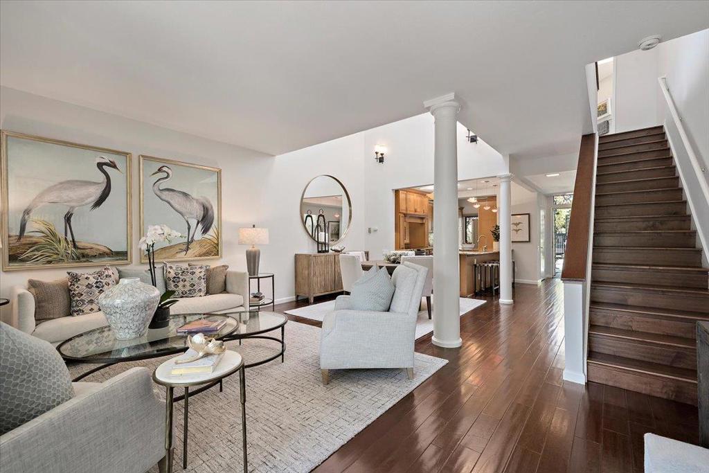 Elegant Waterfront Townhouse - A Masterpiece of Design and Detail Step into a world of architectural artistry in this exceptional home, where no expense has been spared and every detail has been carefully curated. The exquisitely redesigned kitchen blends function with luxury. A skylit dining area is enhanced with elegant sconces, while the living room centers around an abundant wall space for your art collection and a wood-burning fireplace, which opens to a waterfront patio. Wood flooring flows throughout most of the home.The same ambiance continues upstairs. The open loft area offer a versatile canvas for your lifestyle. The second bedroom charms with angled lines, and the hall bath echoes the home's refined aesthetic. The primary suite is a vaulted sanctuary with water views, a custom mirrored barn door, a spa-like en-suite with a grand, porcelain-tiled shower, Hansgrohe Raindance fixtures, marble-countered cabinetry, and crystal waterfall lighting. A generous walk-in closet completes the retreat.3 pools, spa, sauna, 3 pickleball & 1 tennis court. Boat docks for your kayak & paddle-board. Convenient to freeways, shopping & dining. Co-listed with Ann Ellison.