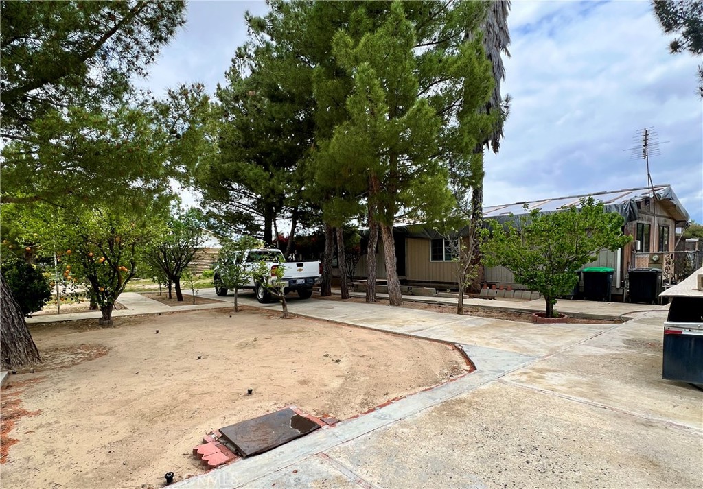 Charming Horse Property Opportunity with Endless Possibilities! Set in a quiet and desirable neighborhood, this 3-bedroom, 2-bath manufactured home sits on a permanent foundation and offers over half an acre of flat usable fenced land—ideal for those craving space, freedom, and flexibility. Whether you're looking to accommodate a growing family, store large vehicles or equipment, or build your dream homestead, this property delivers. Inside, you’ll find a functional and inviting layout featuring an open-concept kitchen and living area perfect for family gatherings or entertaining. The large primary suite includes an en-suite bath with a soaking tub and a separate stand-up shower. An inside laundry room adds convenience to everyday living. The expansive lot opens up a world of opportunity—bring your horses, RVs, vehicles, equipment, or consider adding an ADU or second structure, garden beds, livestock enclosures, or even a workshop. With plenty of space and a flat terrain, you can truly make this property your own. While the home offers solid bones, it invites cosmetic updates and repairs to reflect your personal style and build equity quickly. There are also mature fruit trees in the front yard, including apple, lime, orange, grapefruit, almond and pear. Located just minutes from shopping, dining, and schools, only 3 miles from Lake Elsinore, and with quick access to the Loma Linda University Medical Center in Murrieta, this home also places you only 20 minutes from the heart of Temecula’s scenic Wine Country. For those who love to explore, it’s only about an hour to San Diego’s stunning coastal beaches and downtown district, and about an hour to Dana Point Harbor over the Ortega Highway. Enjoy peaceful rural living without sacrificing convenience—this property is a rare find with endless upside. Come and see the potential for yourself!