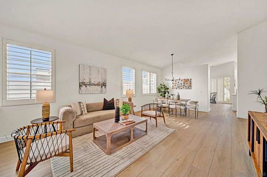 Welcome to 6055 Dassia Way, a beautiful single-level home in the highly sought-after Ocean Hills Country Club. This detached Delphi II model offers a bright and spacious layout with three bedrooms, two bathrooms, and over 1,700 square feet of comfortable living space. The open-concept design connects the living and dining areas to a light-filled kitchen with an island, generous cabinetry, and built-in appliances. A cozy family room with a fireplace opens to a private patio, ideal for relaxing or gardening. Additional highlights include an indoor laundry room with storage and sink, an oversized two-car garage with custom cabinetry, and plantation shutters throughout.  Located within one of North County’s premier 55+ gated communities, residents enjoy an active, resort-style lifestyle featuring an 18-hole golf course, tennis and pickleball courts, a junior Olympic-sized saltwater pool and spa, and countless social clubs and events. With its peaceful setting and convenient access to the clubhouse and nearby coastal amenities, this home combines ease, comfort, and community in perfect balance.