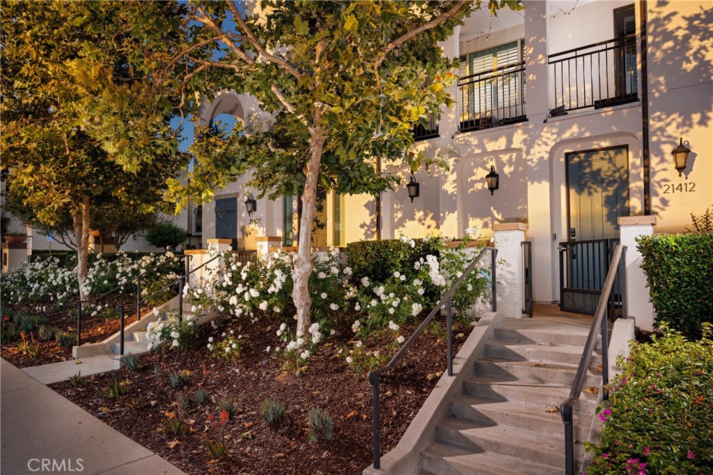 Welcome to the highly sought-after Dahlia Court Complex, nestled in the heart of Rancho Santa Margarita. This meticulously designed condo, built in 2016, boasts modern finishes and spacious floor plans, offering a perfect blend of comfort and style. Enjoy breathtaking sunset views from your private balcony, ideal for unwinding after a long day. The expansive primary suite is a true retreat, featuring a generous walk-in closet and an ensuite bath. The secondary bedroom is also en suite, providing privacy and convenience for guests or family. The private complex park offers a tranquil outdoor space for relaxation and recreation. With award-winning schools and vibrant shopping and dining options just moments away, this property provides the ultimate in convenience and lifestyle.