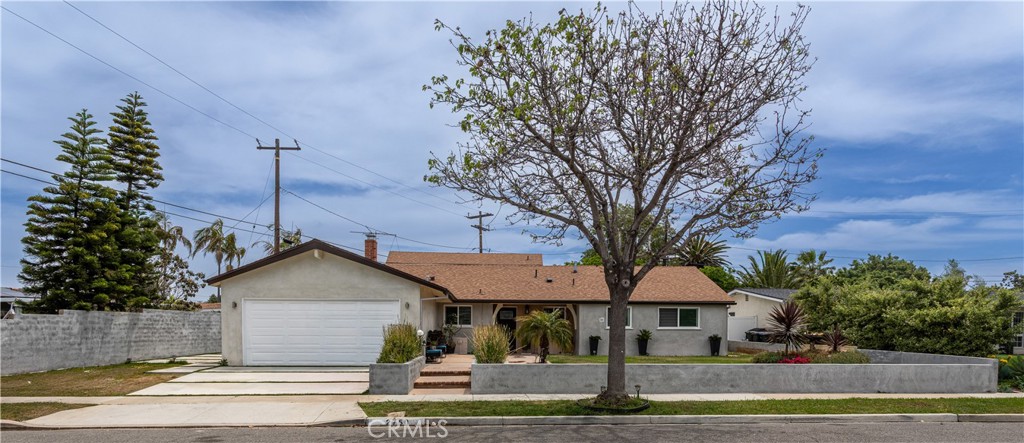 BEAUTIFULLY UPGRADED HOME IN MESA DEL MAR. Welcome to 2705 San Carlos Ln. This stunning 5-bedroom, 2 full-bath and 2 half-bath residence offering 2,193 sq. ft. of exquisitely upgraded living space in one of Costa Mesa’s most desirable neighborhoods. Step inside to find upgraded flooring throughout, creating a seamless flow and low-maintenance charm. The open floor plan is ideal for entertaining, featuring a showpiece kitchen with a large center island, granite countertops, custom range hood, stainless steel appliances, and ample upgraded cabinetry. The inviting family room, anchored by a cozy fireplace and mantle, opens directly to the backyard for effortless indoor-outdoor living. Upstairs, the private primary suite offers its own fireplace and a beautifully renovated en-suite bath. Three additional bedrooms and bathrooms are conveniently located on the main floor. Situated on a spacious lot, the backyard is a true retreat with a covered patio, low-maintenance hardscaping, and fruitful trees. All just minutes from the Costa Mesa Country Club, Santa Ana Country Club, parks, shopping, dining, and the beach—this home blends style, comfort, and location. Schedule your private showing today!
