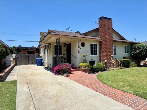 Photo of 12315 Pomering RD, Downey, CA 90242 (MLS # DW26138128)