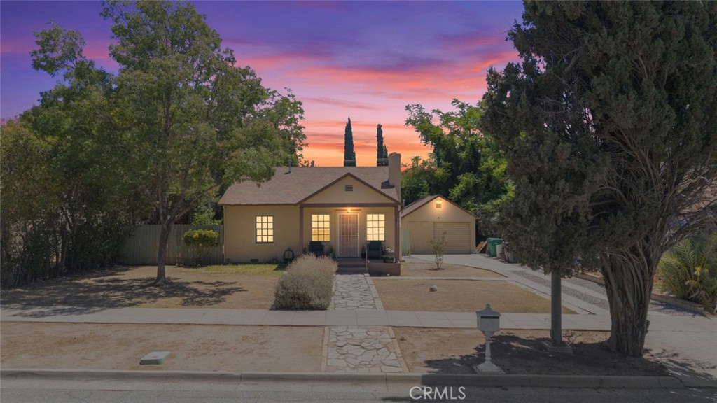 Welcome to this cozy starter home nestled in the heart of Banning! Perfectly suited for first-time buyers or those looking to downsize, this charming 2-bedroom, 1-bathroom residence offers comfort, convenience, and character. Step inside to find wood-like flooring that adds warmth throughout the living spaces, complemented by a welcoming fireplace in the living room—ideal for relaxing evenings at home. The kitchen is both stylish and functional, featuring sleek stainless steel appliances, crisp white cabinetry, and custom light fixtures that add a modern touch. Ceiling fans throughout help keep the home comfortable year-round. Outside, enjoy an ample-sized backyard with endless potential—perfect for weekend barbecues, gardening, or simply soaking up the sunshine. A detached garage provides additional storage or workspace options. Situated near the City of Banning Community Services facility, you’ll love the convenience of staying informed and connected to local events and activities. Don’t miss this wonderful opportunity to own a move-in ready home in a welcoming community!