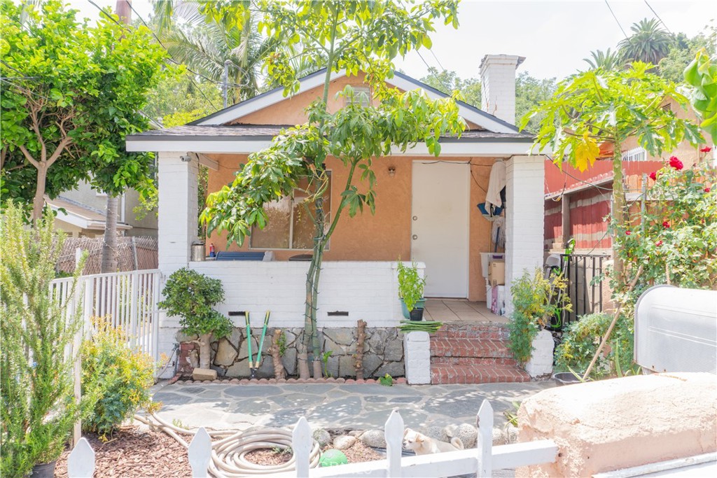 2 Units on one lot in Montecito Heights featuring a front house with 1 bedroom and 1 bath. A rear house fitted with 2 bedrooms and 1 bath. Both units are in good condition and well maintained. The backyard has a stair case that leads up to several areas that could be used for gardening or for a private retreat area. These two homes are located in the highly sought after neighborhood of Montecito Heights/Rose hills area . Your surrounding neighborhoods are Alhambra, South Pasadena, Lincoln Heights and Downtown Los Angeles. This wonderful home is minutes from Cal State L.A., USC Medical Center, restaurants, shopping, schools and freeways. This property is perfect for investment or living in one unit and renting the other.