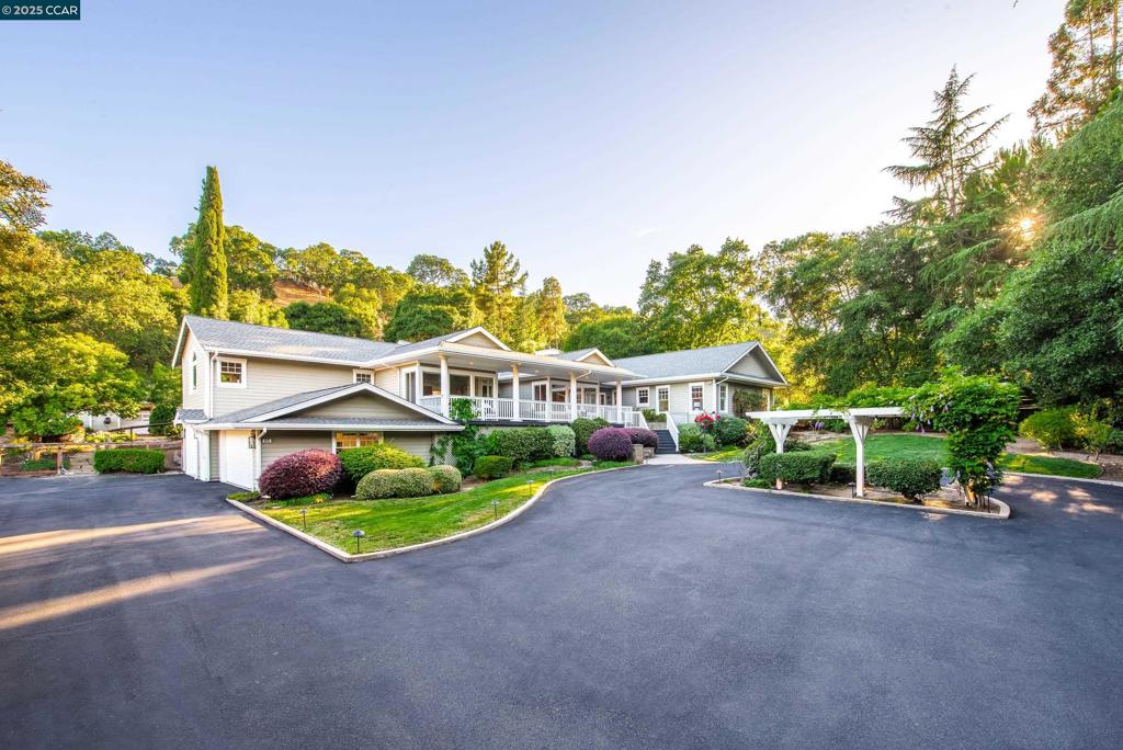 Welcome to your private retreat in Lafayette’s coveted Reliez Valley. Set behind a gated entrance on 1.4± acres of beautifully landscaped grounds along one of the area’s premier roads, this exceptional country estate offers a rare blend of space, comfort, and timeless elegance. Enjoy mostly single-level living bathed in natural light, with soaring vaulted ceilings, hardwood floors, and expansive windows that frame serene views of the surrounding grounds. The 4-bedroom, 3.5-bathroom main house is complemented by a charming detached 1-bedroom, 1-bath guest house complete with a kitchenette and two additional storage rooms or potential horse stalls. At the heart of the home, the great room showcases a fireplace, custom built-ins, and seamless flow into the chef’s kitchen with a large center island, breakfast bar, and casual dining area, perfect for both everyday living and entertaining. The bedroom wing includes a luxurious primary suite and three spacious secondary bedrooms, while a separate office, bonus/family room, and mudroom provide flexible space. Whether you’re hosting gatherings, gardening, keeping animals, or simply enjoying the peaceful setting, this gated property offers endless opportunities. Ideal location minutes to town, Briones, hiking trails & top-rated schools!