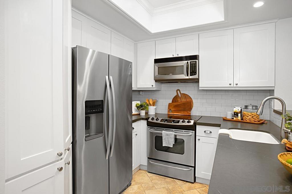 Furnished retreat in the Heart of Marina District, Downtown San Diego. Welcome to your own slice of urban paradise! This impeccably designed one-bedroom, one-bathroom condo offers a harmonious blend of modern elegance and city convenience, offering 735 square feet of thoughtfully crafted living space. Nestled in the prestigious Marina District of downtown San Diego, this condo offers a lifestyle that combines luxury, comfort, and unparalleled access to the vibrant energy of the city. This updated condo features custom paint, built ins, porcelain tile floors throughout, plantation shutters, granite surfaces, stainless-steel appliances, and a large primary suite with an organized, walk-in closet and spacious bathroom. One car underground garage spot included.