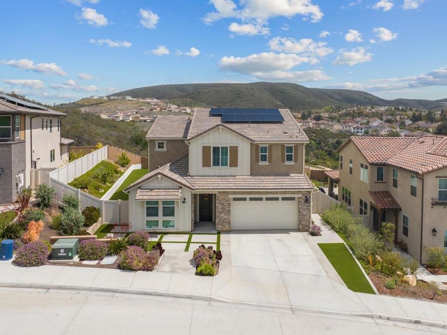 This stunning 4-bedroom, 4.5 bath home, located in the highly desirable Skylark community, offers modern living at its finest. Featuring a PAID OFF solar panel system, this home is energy-efficient and eco-friendly. With over $90,000 invested in premium landscaping and water filtration systems throughout, it is truly move-in ready.  Spanning 3,175 square feet, the open-concept layout seamlessly connects the spacious living room, dining area, and gourmet kitchen, which boasts premium countertops, a sleek quartz backsplash, stainless steel appliances, and abundant cabinet space—ideal for cooking and entertaining.  The first floor also includes a private room, perfect for family, guests, or even as an independent rental unit. Upstairs, the luxurious master suite offers a walk-in closet and a spa-like bathroom with dual vanities and a soaking tub, providing a peaceful retreat. Two additional bedrooms share beautifully appointed bathrooms, while the versatile loft space is perfect for a home office, playroom, or whatever your lifestyle needs.  Step outside to enjoy the community's playground dog park, and walking trails, all just a short stroll away. Located just 10 minutes from shopping at San Marcos Grand Plaza and Costco, and only a 5-minute drive to Palomar College, convenience is key. Golf enthusiasts will appreciate the proximity to nearby courses like Twin Oaks and Shadowridge.  This home offers the perfect blend of comfort, style, and location—don’t miss the opportunity to make it yours!