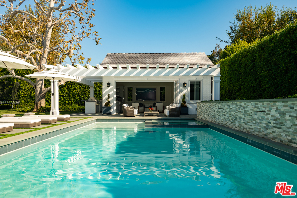 Situated in Pacific Palisades prime Riviera neighborhood, sits this stately and pristine East Coast traditional estate. This property offers privacy and serenity with it's grand open floor plan designed to offer an abundance of natural light along with wonderful California indoor outdoor living. The property consists of six bedrooms and nine bathrooms including a wonderful private master suite, with unmatched closet space. Additionally you will find a bright open chef's kitchen and family room area, formal living room and dining room, theater, gym, wine cellar, sauna, and an elevator. To top it off, there is a beautiful backyard with a sparkling swimming pool and guest house. This home was meticulously designed to offer the quintessential luxury lifestyle.