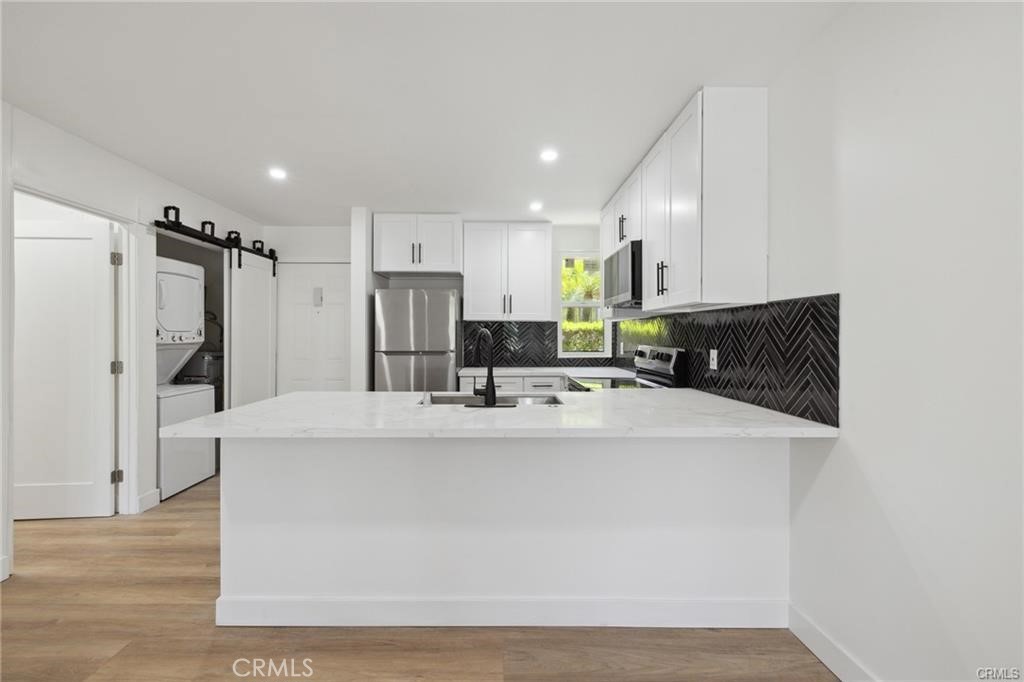 Limited-Time Offer: Get 1 Month Free When You Sign a 12-Month Lease! 1-Bedroom Apartment with Private Balcony in Prime Encino Location. This thoughtfully updated 1-bedroom, 1-bathroom residence offers comfort, style, and convenience perfect for individuals seeking a well-appointed home in a prime Encino location.Key Features: Open layout with hardwood floors. Private balcony ideal for relaxing after work or enjoying your morning coffee. Sleek kitchen equipped with LG stainless steel appliances and ample storage. Updated bathroom with modern fixtures and clean design In-unit washer and dryer for maximum convenience. Walk in closet and new ac units. Secure, gated parking available. High-speed internet ready perfect for remote work or streaming. Community & Location: Access to a sparkling pool and Pet-friendly. Walk to Ventura Blvd's top restaurants, cafes, and boutique fitness studios. Close proximity to Lake Balboa Park and Woodley Lakes Golf Course great for outdoor activities. Easy access to the 101 Freeway, making commuting to Sherman Oaks, Studio City, and West L.A. simple and quick. Located in a highly rated school district and near major hospitals and business centers.