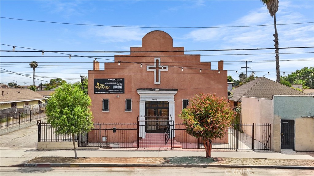 Currently operating as a church, this property offers excellent potential for continued religious or community use, or future redevelopment opportunities—subject to City of Los Angeles approvals.
The existing 3,044 SF structure features a welcoming sanctuary, administrative office, kitchen, and restrooms, with a flexible layout ideal for worship services, community programs, or nonprofit operations. Set back from the street and gated for privacy, the property offers both visibility and convenience with easy access to major thoroughfares.
A private parking lot accommodates 8–10 vehicles.
Located in the vibrant and evolving Westmont neighborhood of South LA, this site is surrounded by cultural richness, community pride, and long-standing neighborhood ties. Nearby amenities include local eateries, green spaces such as Jesse Owens Park, schools, and transportation hubs. The 105 and 110 freeways, as well as Metro Blue Line stations, are easily accessible—ideal for congregants, staff, or future residents.
Whether you are a faith-based organization, nonprofit, or investor seeking to make a lasting impact, this property offers both immediate functionality and long-term potential.
Buyers to verify all zoning and use possibilities with the City of Los Angeles. Property to be sold as-is.