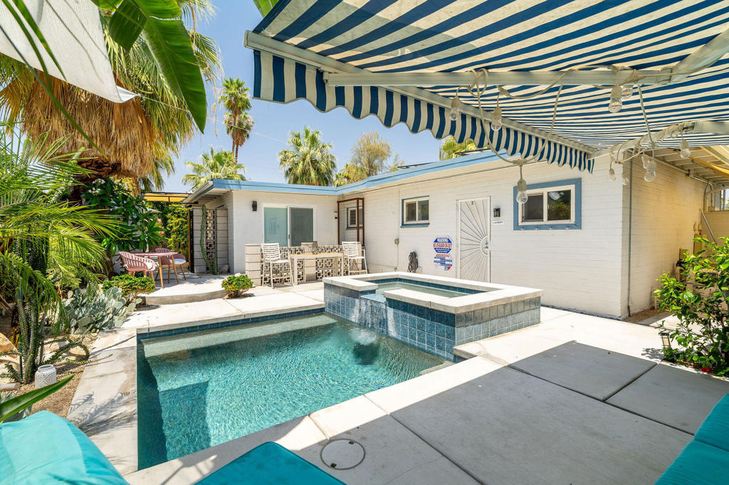 Charming Triplex in the Heart of Warm Sands.Welcome to a rare investment opportunity in the highly sought-after Warm Sands neighborhood of Palm Springs. This well-maintained triplex offers timeless desert charm, mountain views, and strong rental potential--just minutes from downtown.Each of the three units exudes classic California Bungalow character, with private outdoor spaces perfect for enjoying the year-round sunshine. Mature landscaping, and a shared pool & spa with mountain views create an inviting, tranquil atmosphere.With updated systems and potential for long-term or seasonal rentals, this property is ideal for investors, owner-occupiers, or those seeking a live-in-one, rent-the-rest scenario.Units 1 & 3 are tenant-occupied on month-to-month agreements, while unit 2 has been utilized as a 29+ day seasonal rental, and the single car garage is used as owner storage. Owned solar with Tesla battery storage offsets utility expenses, and the coin-op community laundry provides additional revenue. Located in a vibrant, walkable area close to shops, restaurants, and entertainment, this home is a true Palm Springs gem--ready to generate income or become your personal desert retreat. Schedule your private showing today!