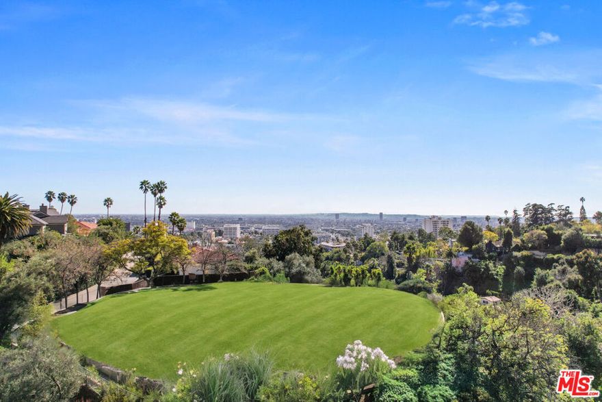 An incredible and rare opportunity to create your dream home in the heart of the Hollywood Hills. This rare, nearly 1-acre promontory lot in prestigious Outpost Estates is shovel-ready with RTI (Ready to Issue) permits for a stunning 9,300 sq. ft. gated contemporary estate. This property has a large, flat lot with incredible views from Downtown Los Angeles to the ocean, offering endless possibilities. Designed with privacy and luxury in mind, this estate showcases organic finishes and features a secure gated entrance, a long private driveway, and a spacious 3-car garage. A stylish ADU offers comfortable accommodations for guests or staff, while the expansive backyard highlights a stunning pool with breathtaking city light views. Whether you're an end-user looking to build your forever home or a developer seeking a high-end project, this property delivers unparalleled potential in one of Los Angeles' most sought-after locations.Conceptual schematics and renderings are available to help bring this vision to life.