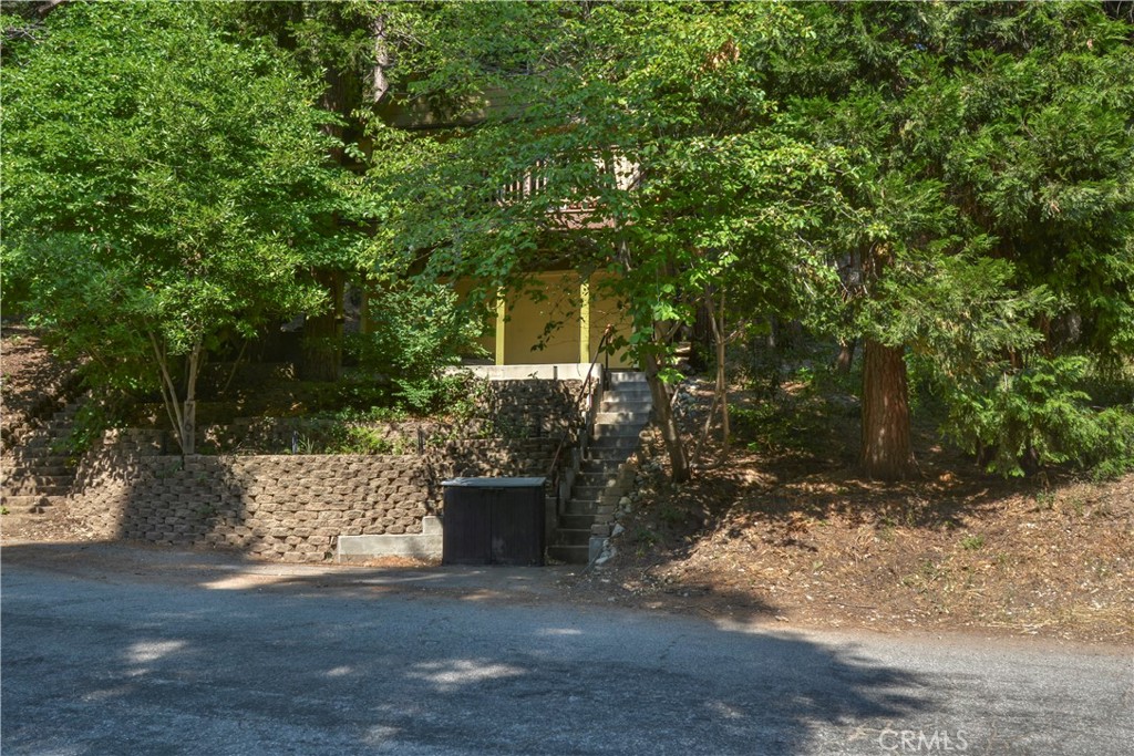 This cute cabin nestled in the trees of the Arrowhead Villas. Great mix of an old cabin with newer up to date amenities. Sits on top of Arrowhead Villas road hidden by a few mature trees for privacy. Beautiful pine T&G wood walls. Hardwood floors run throughout the home as well. This could be your little cabin away from it all.Sits on a corner lot which helps give you a more private feel. Home is also an active Airbnb with outstanding reviews.