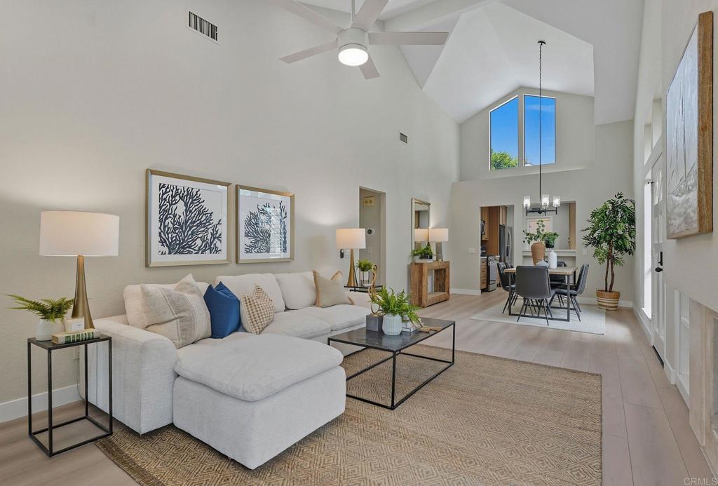 Resort-style living in the gated Sea Cliff community—just 1 mile to the beach! Enjoy two saltwater pools and spas, clubhouse, pavilion, lighted tennis courts, scenic walking paths, tranquil ponds, and expansive greenbelts in one of coastal Carlsbad’s most desirable neighborhoods. This beautifully renovated single-level home offers 3 bedrooms, 2 baths, and 1,265 sq ft of open-concept living with vaulted ceilings and luxury vinyl plank flooring throughout. The updated kitchen features quartz countertops, new cabinetry, and stainless steel appliances. Both bathrooms have been stylishly remodeled with modern tilework, quartz vanities, and designer fixtures. The spacious primary suite includes a dual vanity, tiled step-in shower with glass doors, high ceilings, and a skylight. Gated front courtyard, cozy gas fireplace, indoor laundry, and 2-car garage add convenience. Relax on the low-maintenance back patio with pergola and peaceful views of the greenbelt and pond.