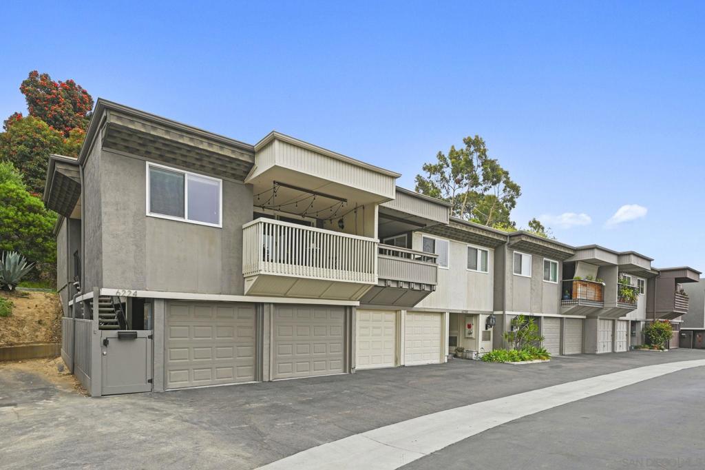 THE ONE THAT CHECKS ALL THE BOXES! This bright end-unit townhome checks all the boxes, FHA & VA approved, private setting, and gorgeous open views. Enjoy rare greenbelt privacy with no neighbors behind you, a feature that truly sets this home apart in Friars Village! Unlike most units with two shared walls, this one shares only a single wall, offering an exceptional sense of space and quiet. Inside, the 2 bed / 1 bath layout feels airy and inviting with dual-pane windows and sliders (updated within the last 5–6 years) and three energy-efficient mini-splits providing year-round comfort. The open-concept living area flows seamlessly to a private view patio, perfect for relaxing or entertaining with serene greenery as your backdrop. Practical perks include in-unit laundry, an attached two-car garage with direct access, and a low-maintenance lifestyle ideal for busy professionals, students, or first-time buyers. Community amenities feature a pool, spa, clubhouse, BBQ areas, and playground, all in a prime Mission Valley location just minutes from USD, Fashion Valley, Mission Bay, and Downtown, low-maintenance living with unmatched privacy, comfort, and convenience that truly stands out from the rest.  Seller-reported updates include a new electrical panel (2025), new garbage disposal, added kitchen backsplash, new kitchen faucet, a painted bathroom vanity with new hardware, new bathroom light fixtures, a new medicine-cabinet mirror, new hallway light fixtures, storage racks installed in the crawl space, and a wooden surf rack in the garage.