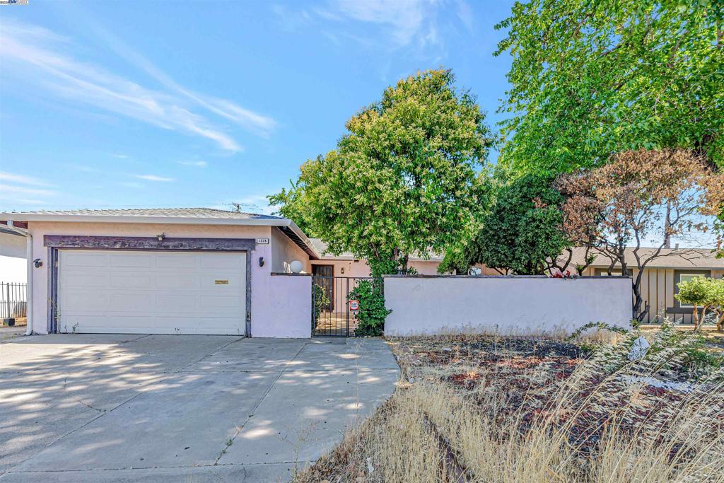 Explore the potential of 1228 Buchanan Rd, a 3-bed, 2-bath home in Antioch with 1,302 sq ft of living space on a spacious 7,187 sq ft lot. A large bonus room offers flexibility as a 4th bedroom, dining room, family room, or office, depending on your needs. The layout includes an ensuite bedroom, an updated bathroom, a 2-car garage, and great bones ready for your personal touch. Fresh interior paint, dual-pane windows, and central heat and AC provide a solid starting point. The oversized lot offers even more possibilities. Add an ADU, expand your outdoor space, or design the backyard you’ve always wanted. With a little vision and creativity, this home can truly shine. Conveniently located near Contra Loma Regional Park, schools, shopping, and Tri Delta Transit, with easy access to Target, Costco, and Somersville Rd for everyday needs.