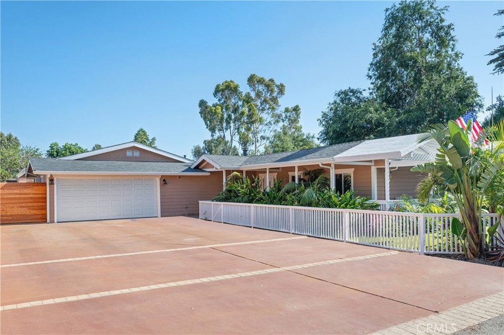 Rare Treasure in Orange Park Acres! Prime location in the East Orange foothills! Beautifully remodeled three bedroom horse property residence offers a dream garage set-up with four cars plus, a fantastic workshop accessible to the backyard and additional large theater rec hobby room. Inviting wrap-around porch. Open floor plan highlights include a lovely, remodeled kitchen, center island with breakfast bar, handsome plank like flooring and stone accents. Adjacent family room with stylish fireplace, opens to the updated kitchen and informal eating area. Master bedroom has a wonderfully large walk-in closet and backyard patio access. Lavish master bathroom adorned with travertine vanity, shower and flooring plus a large spa tub. Other features include an office, which can be a 4th bedroom, ceiling fans, and multiple skylights giving a light and bright ambiance. For energy efficiency, the home has solar power, LED lighting. Newer 2 unit HVAC system, roof, pedestrian doors, garage door, and exterior siding. Enjoy the fully fenced yard with synthetic grass front and back, tropical landscaping with automatic trickle system. Fabulous custom backyard entertainment patio with barbecue island and exterior lighting. Greenhouse with automatic water system. Large driveway provides an abundance of space for extra parking and RV potential. Epoxy floors in garage and rec room. For the equine enthusiast this property offers 2 box stalls and shed that can be a tack room or hay/supply room. Close to the Orange Park Acres trail system and three regional parks for walking, hiking and horseback riding. Live the country lifestyle while close to city amenities and enjoy all the benefits the Orange Park Acres community has to offer.