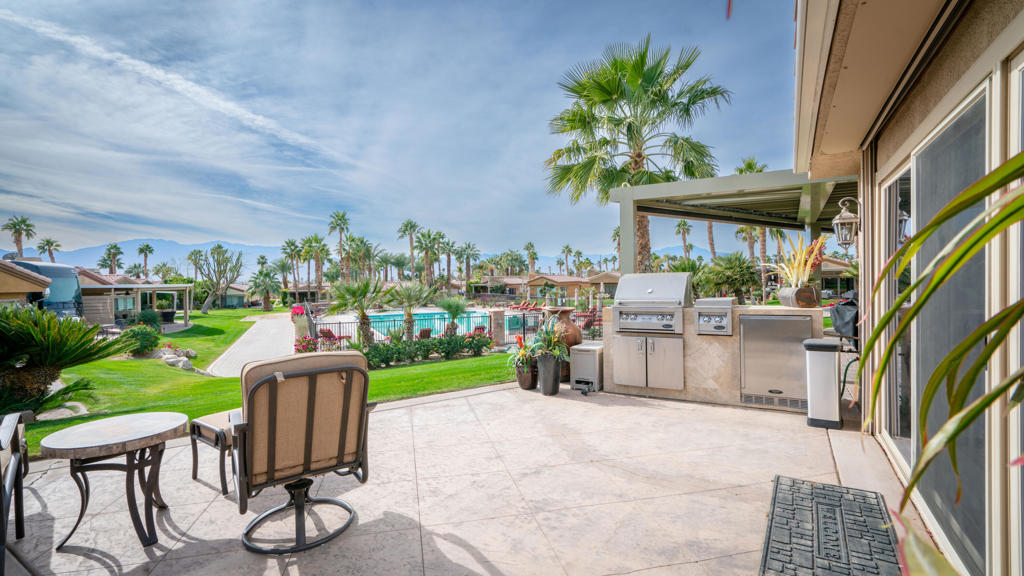 Nestled in the prestigious Vineyards Luxury Motorcoach Resort in Coachella, this Plan 3 Casita is an entertainer's dream. Overlooking the vibrant community and just steps from the resort's sparkling pool, it offers a perfect blend of luxury and convenience. The property features spacious RV parking with full hookups, ideal for large Class A motorcoaches, and stamped concrete that adds elegance and durability. The windows are fitted with durable security metal covers, ensuring your property stays safe. Motorized screen shades and an adjustable awning, operated effortlessly by remote, allow you to control light and shade with ease, creating the perfect ambiance. Thoughtfully designed and ideally located, this casita offers a lifestyle of comfort, security, and sophistication. Schedule a tour today and experience resort living at its finest!