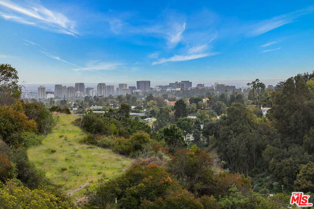 Attention all major developers! Incredible development opportunity! Build 5 mega houses with city and ocean views minutes from The Beverly Hills Hotel and Rodeo Dr. This property includes 10 acres plus 2 single-family homes, 4 huge buildable lots with huge flat pads with major ocean and city views. The property includes 12 APNs: Spectacularly located on a private road about 1/4 mile off of Benedict canyon... This also includes full architectural plans for a 12,000 sqft house. APN # (4356-010-014; 4356-010-029; 4356-010-030; 4356-010-020; 4356-010-022; 4356-011-018; 4356-025-021; 4356-025-013; 4356-025-014; 4356-025-016; 4356-025-018; 4356-010-021)..