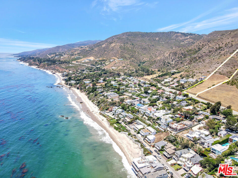 Panoramic ocean views from Santa Monica past Broad Beach. What an amazing ocean view gem of a lot, 5.75 amazingly level land provides so much room to build that magnificent Malibu Ocean dream estate. Lot goes up the hill past the cleared-out area. slightly raised frontage on the PCH. You won't find this much usable ocean view land often. Fabulous location, across from the beach, near restaurants, schools, and stores. It's very easy to find. You must not let this one go!!