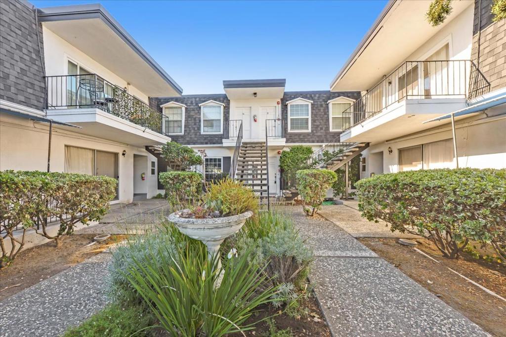 At 1,050 square feet, this first-floor unit with an open-concept design is the perfect combination of convenience and charm! The living room has tiled floors and its open floor plan allows it to share the space and ambiance with the dining area. A sliding glass door leads out to a large patio that offers the perfect spot for indoor/outdoor dining, living, and gardening! The kitchen provides ample storage space and countertops. Bedrooms are fully carpeted, generously sized. They conveniently share a full bath with a tub, shower, large mirror, and two sinks. This home is located in a beautiful and quiet cul-de-sac and comes with a 2-car, covered side-by-side garage and lots of closets and storage space, including 2 big storage units. Residents enjoy community amenities, including 4 pools and a newly refinished tennis court! The condominium is centrally located, just blocks from El Camino Real and the Central Expressway, making it easy to get around the peninsula as well as going out to 101 or 280! Its also near local shopping centers and movie theaters, downtown Mountain View/Castro Street, and a quick drive to Stanford, Google, and many other places of interest. The area is walkable to local schools, parks, and the Mountain View library. Pet Friendly Pet Deposit - $500