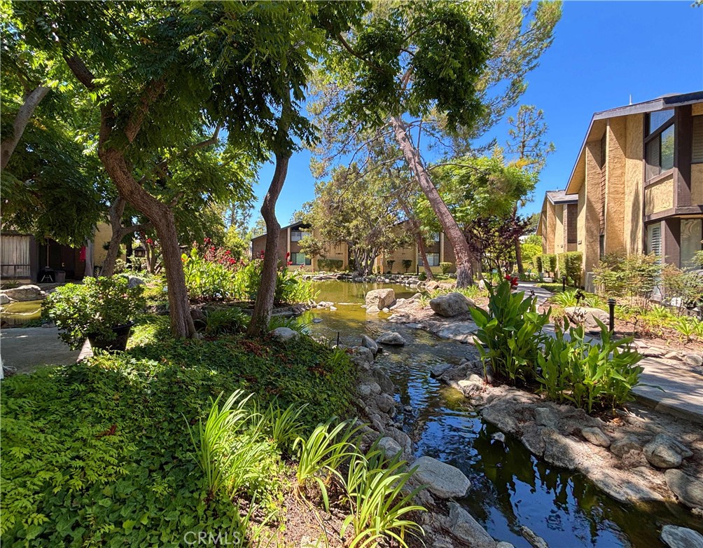Welcome to Lakewood Shores – a serene, gated community where tree-lined paths, flowing streams, and peaceful ponds create a tranquil backdrop for everyday living. This two-story townhome-style condo offers 2 spacious bedrooms, 1 full bath, and over 1,050 square feet of living space, along with two assigned parking spots for added convenience.
Step inside to a light-filled living area perfect for relaxing evenings at home. The private patio off living area overlooks one of the community’s charming waterways, offering a peaceful setting to enjoy your morning coffee or evening breeze.
While the unit has not been recently remodeled, it’s clean, functional, and full of potential — a fantastic opportunity for a buyer looking to add their own personal touch and style. Upstairs, you’ll find both bedrooms, high ceilings, and a hallway skylight that brings in great natural light.
Enjoy in-unit laundry hookups, central heating and air, and access to Lakewood Shores’ resort-style amenities, including two pools, spas, and tennis courts — all surrounded by lush landscaping and tranquil streams.
Centrally located near shopping, dining, freeways, and within the highly rated ABC School District, this is a rare opportunity to own in one of Lakewood’s most picturesque and sought-after communities.
Laundry closet with washer and dryer hookups on patio. Upstairs bedrooms have vaulted ceilings and skylights. Gated complex with two pools, a sauna, and 2 tennis courts. All within the ABC School District. No Garage with the unit, BUT the unit comes with two assigned parking spaces: one Carport space (#191) and 1 assigned open parking space (33-S) near the unit. Guest parking is available in front of the unit. Water and trash are included in HOA dues which is a bonus!