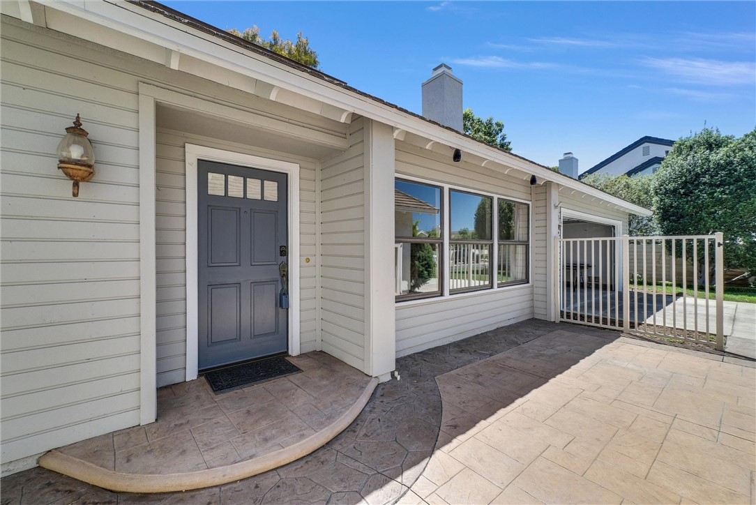 Welcome to this private and comfortable single-level home, situated in the highly sought-after Woodbridge community. Offering 1,323 sq. ft. of living space, this residence features two spacious bedrooms and two bathrooms. Step inside through the front entrance and be greeted by an open floor plan, soaring vaulted ceilings, a cozy fireplace with a mantel, and an abundance of windows that fill the home with natural light. The layout is both functional and welcoming, perfect for everyday living and entertaining. Enjoy outdoor living in the expansive, private backyard, complete with a covered patio-ideal for relaxing or dining al fresco. The attached two-car garage includes both front and rear access to the outdoors, while the extended driveway provides ample parking for up to six vehicles. Residents of the Woodbridge Village Association enjoy access to an impressive array of recreational amenities. These include two scenic lakes with docks, two beach lagoons, 22 swimming pools, 16 spas, 13 wading pools, 23 tennis courts, 4 pickleball courts, and fishing. Additional features include a splash pad, multiple parks with playgrounds, volleyball courts, horseshoe and shuffleboard areas, an outdoor fitness course, as well as basketball, bocce ball, and much more. In total, the Association owns and maintains 41 outstanding recreational facilities, offering something for everyone to enjoy. Conveniently located less than a mile from multiple shopping centers, with easy access to the 405, 5, and 55 Freeways; less than 3 miles from UC Irvine and approximately 4 miles from John Wayne Airport. This home combines comfort, privacy, and practicality in one of the area’s most desirable neighborhoods. No Mello Roos! Amenities photos coming soon.