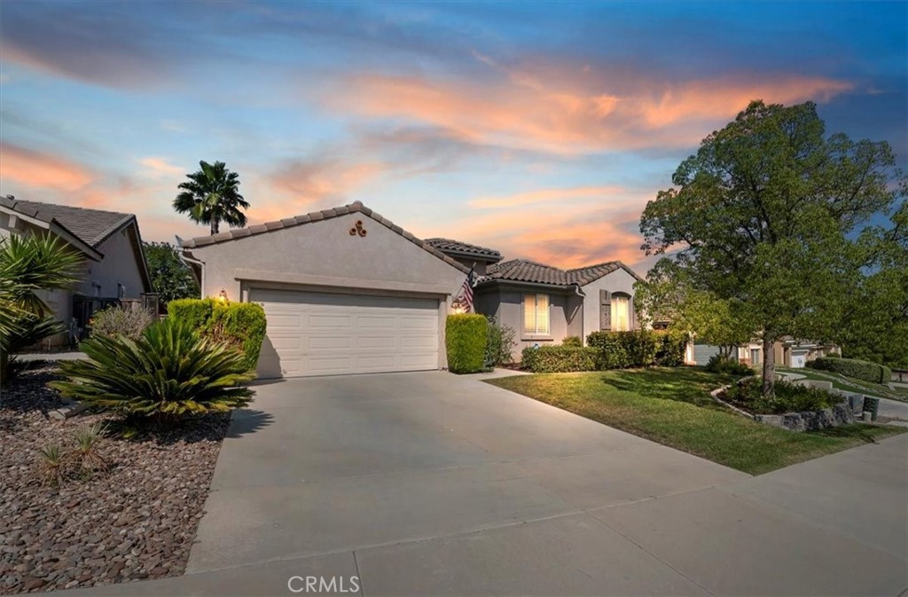 Welcome to this beautifully maintained single-level home nestled on a quiet cul-de-sac in a desirable, centrally located neighborhood with no HOA. Offering 4 bedrooms and 2 full bathrooms, this home features an open-concept layout ideal for both everyday living and entertaining. Step into the heart of the home where the kitchen boasts granite countertops, ample cabinetry, and a seamless flow into the dining and living areas. Plantation shutters, fresh paint, and oversized windows create a bright and welcoming atmosphere. Retreat to the oversized primary suite, complete with elegant double-door entry, double sinks, a soaking tub, separate shower, and a generous walk-in closet. Enjoy outdoor living under the covered patio, surrounded by mature fruit trees and a tranquil pond, offering a peaceful backyard oasis. The 3-car tandem garage offers plenty of room for parking, storage, or even a workshop setup. This home combines comfort, convenience, and charm — all in a prime location close to shopping, dining, and schools. Don’t miss your chance to make it yours!