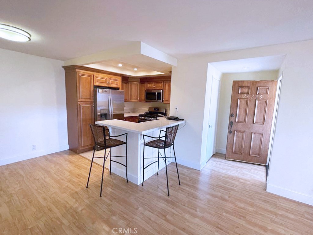 Upper-level unit in a highly desired gated community of Casa La Paz in Laguna Niguel. The kitchen is upgraded with Stainless Steel Appliances, New Stove and Oven, New Microwave and New Dishwasher. It also has a a Breakfast Nook. Laminate Flooring throughout the unit. Stackable washer/dryer in the unit. Walking closet in the bedroom. The unit comes with one assigned parking space. The community provides access to a pool and spa. Enjoy the convenience of walking to shopping and dining across the street, including Target, Costco, In-N-Out, Starbucks, Home Depot, Sprouts, and more. A short drive takes you to Aliso Viejo Town Center with additional retail, restaurants, and entertainment options including Edwards IMAX Theater. Easy access to the toll road.