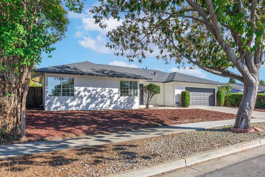 Welcome to 4824 Rue Calais, a beautifully updated 4-bedroom, 2-bath residence in the heart of San Jose. This thoughtfully improved home spans 1,446 square feet on a generous 6,480 sq. ft. lot, blending comfort, efficiency, and modern appeal. Step inside to find a freshly painted interior, new kitchen with custom cabinetry, quartz counters, and upgraded fixtures. Both bathrooms have been stylishly renovated, including a new hall tub and refinished primary shower. The open-concept kitchen and family room combo offers an inviting space for daily living and gatherings, anchored by a cozy fireplace and warm laminate floors. Major upgrades include a brand-new sewer lateral, ensuring years of worry-free service, and a new integrated solar roof system that provides clean, renewable energy and reduces utility costs. Exterior enhancements include new siding, paint, fencing, landscaping, and improved curb appeal. Additional features: two-car garage with laundry area, ceiling fans, and forced air heating. Located within the desirable Oak Grove Elementary School District, this home is a turnkey opportunity offering modern convenience and sustainable living in a vibrant San Jose neighborhood.