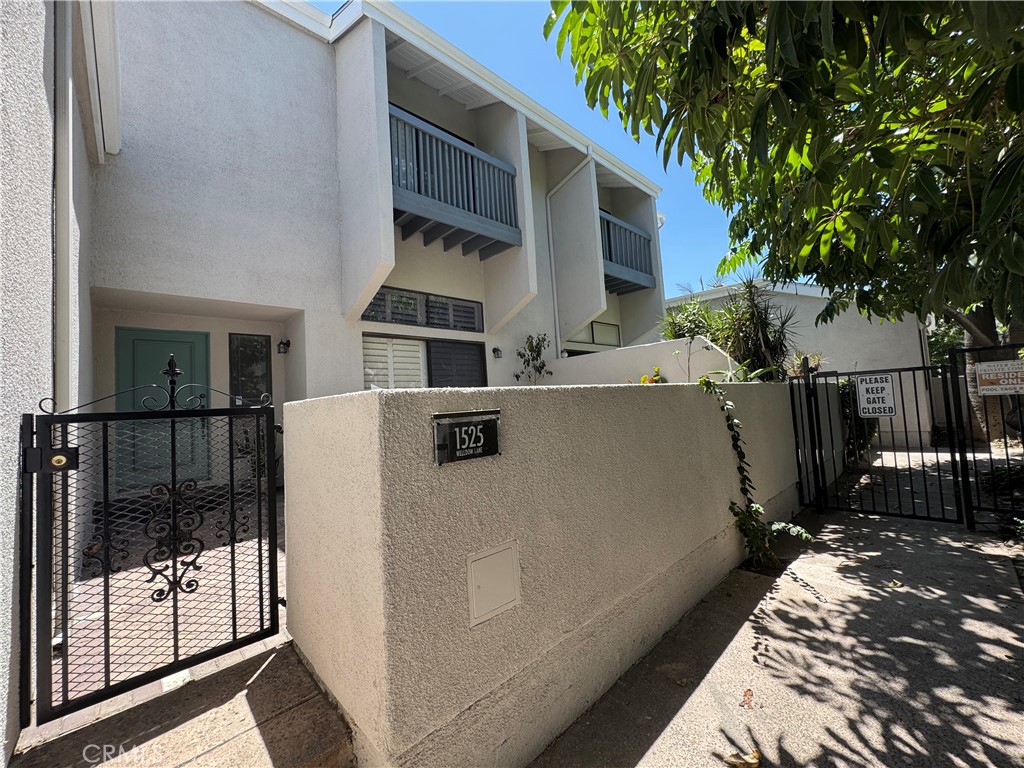 This is a gorgeous condo and located in Water Garden's Beauty. Enter This home through a beautiful front yard with a secure iron gate. Enter the door you are greeted with high Ceilings large Living Room with a cozy fireplace and This is a formal dining room above the living room that cheerfully welcomes any visitor. Besides style and charm this townhouse has 3 bedrooms and 2.5 bathrooms .There is a large master suite with walk-in closet and with a private balcony. A large , friendly kitchen with a new ceiling fan and wonderful family room off the kitchen. Lots of closets with plenty of storage space.2 car attached garage with roll-up doors, The Water Gardens Community has three Pools & Spa and water fountain with a secure iron gate. Very convenient location with retail shopping center ,Cal state Fullerton and the 57 Freeway and Troy Hight School which is a good school district .This home is super clean and ready to move in.