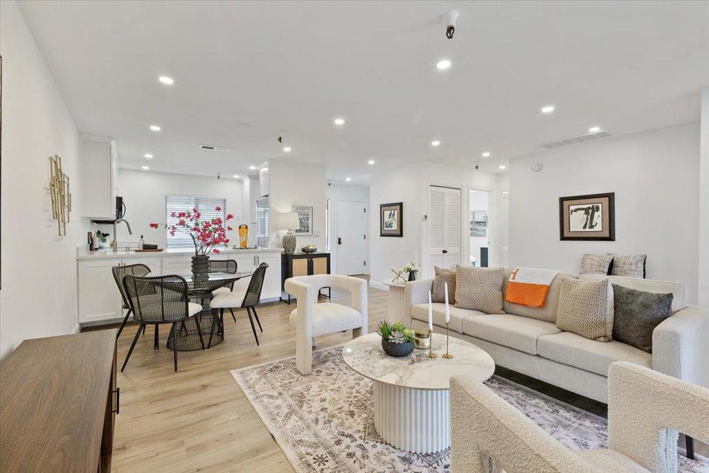 Stunning Interiors with Views, Views, Views! Premiere corner unit in the heart of downtown Los Gatos. Located in the highly sought-after Los Gatos Commons, a premier gated community for ages 55+, this home offers the best location with stunning mountain and greenbelt views. Renovations from top to bottom, the light-filled interior features a modern farmhouse-inspired kitchen with quartz countertops, newer stainless steel appliances. Elegant wood-look plank flooring throughout, complemented by recessed lighting, central heating, & AC for year-round comfort. Luxurious Primary Suite. Two renovated baths. Elevators in community, no stairs required! Resort-style amenities include a solar-heated pool, spa, fitness center, clubhouse, library, game room, BBQ area, lush gardens, and covered walkways for year-round strolls. Secured behind gates for peace of mind, with one assigned covered parking space plus storage and additional open parking. HOA provides water, garbage, basic cable and internet.