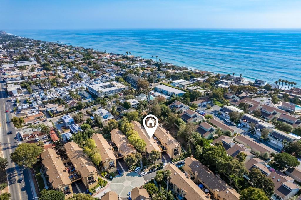 Discover the best of coastal living in this remodeled townhome, ideally located just blocks from Grandview and Ponto Beaches. Situated in the coveted Pacifica community, this rare find offers a thoughtfully updated two-story layout designed for modern comfort and style. Every single area of this property has been remodeled from the custom cabinetry to the hardwood floors. Enjoy high-end appliances, recessed lighting, and elegant finishes throughout. Step outside to relax on the spacious sun deck or enjoy your morning coffee from the private balcony, both overlooking beautifully landscaped greenery. The oversized two-car attached garage provides generous storage and a convenient laundry area.Tucked away on the peaceful west end of the community, this home offers added privacy and easy access to the pool and spa. Don’t miss this rare opportunity to own west of the 101 in one of San Diego’s most desirable neighborhoods!