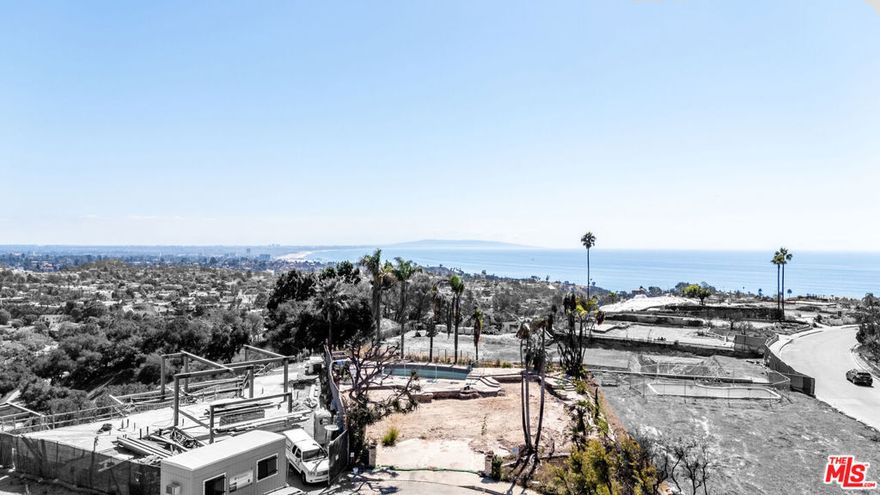 Set on one of the most desirable and picturesque streets in Marquez Knolls, this entirely flat lot offers exceptional privacy on a serene cul-de-sac. The property enjoys an elevated position with panoramic views stretching from the city to the ocean, depending on the future design.The previous home featured a rooftop deck capturing sweeping vistas that stretch from Downtown Santa Monica and the iconic Ferris wheel all the way to the tranquil ocean horizon showcasing breathtaking sunsets and a reminder of the extraordinary vantage point this property affords.  An exceptional opportunity to create your dream home in one of Pacific Palisades' most sought-after neighborhoods just moments from Palisades Village, Sunset Boulevard, the beach, and top-rated local schools.