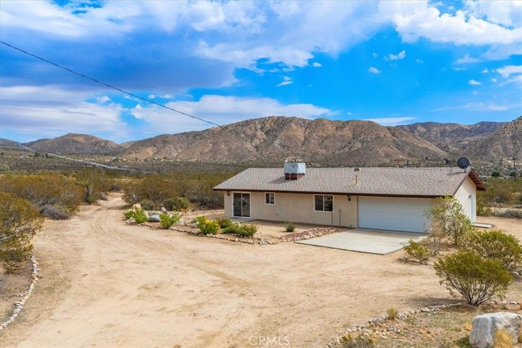 Photo of 8887 Little Morongo rd Rd, Morongo Valley, CA 92256 (MLS # JT25240419)