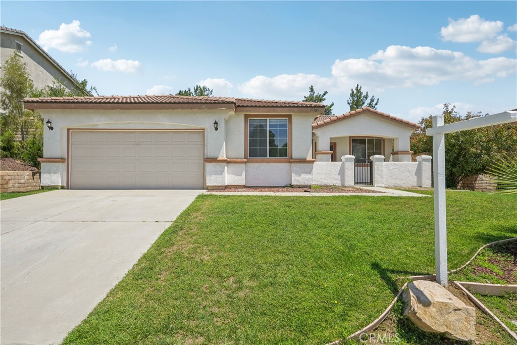 Elevated experience with the best of Lake Elsinore from this bright single-story home built in 2004 , offering 4 bedrooms, 2 full baths and bonus room that can be used as a work from home office or 5th bedroom. 1954 sqft of comfortable living space. situated on a 7840 sqft elevated lot, the properties provide panoramic hillside views with the lake within view as you step out of your front door all in a tranquil park side setting. Inside, open concept layout with tile floors in kitchen, dining room and bathrooms, with brand new carpet complementing the remainder of the home. Abundant light gives a comfortable vibe and a cozy fireplace in the living room is a welcome upgrade. The kitchen features amble cabinetry and breakfast bar, flowing seamlessly into the adjacent living space. All four bedrooms and the two full baths on one level, ideal for family convenience or accessibility. Additional highlights include a 2-car attached garage, central heating and air and a durable tile room which includes a lifetime transferrable warranty. Located near McVicker Canyon park, schools, shopping and with easy access to the 15 freeway, this home combines lifestyle and functionality. Low maintenance yard.