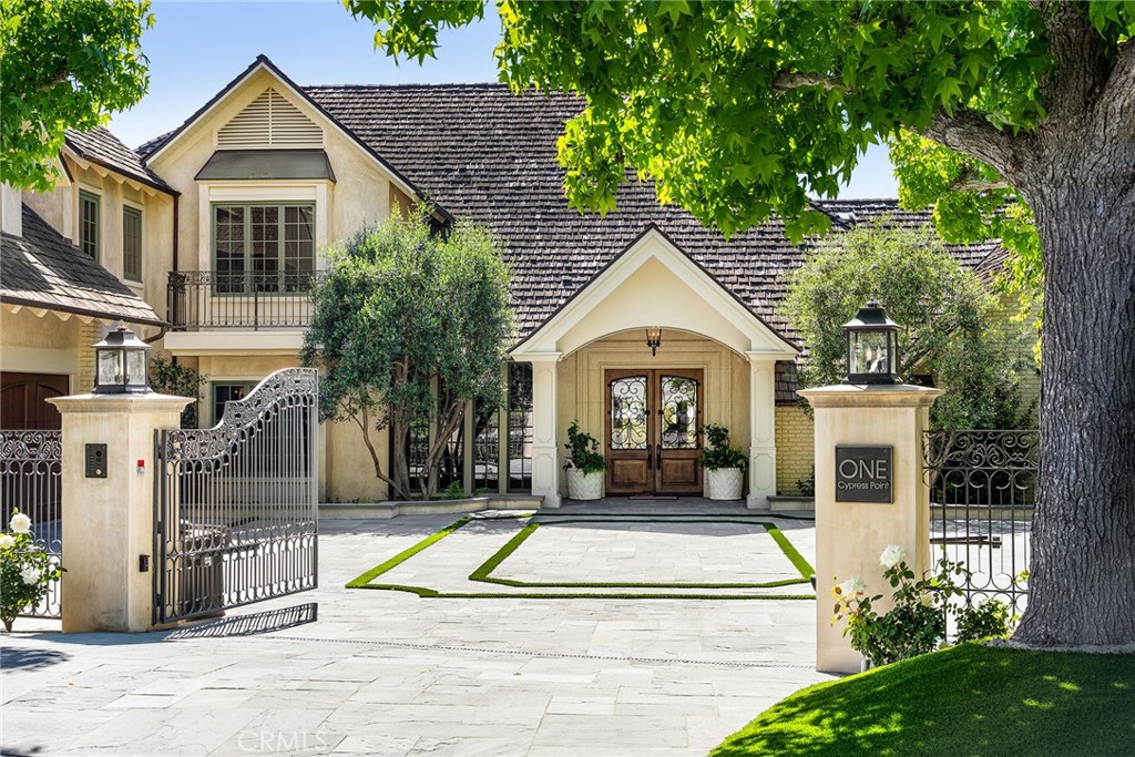 Ideally located within the prestigious guard-gated enclave of Big Canyon Country Club in Newport Beach, this exquisite home features six en-suite bedrooms with two additional half baths and seamlessly blends timeless French Provencal architecture with modern luxury. Positioned on a prime 13,800 square foot cul-de-sac lot, with an impressive 200 feet adjacent to the golf course, the home boasts commanding views of the 18th green, driving range, chipping and putting areas, as well as the Big Canyon Clubhouse and Fashion Island skyline; all perfect viewing for morning coffee and evening sunsets. Spanning approximately 8,000 square feet of finely curated living space, this residence is a rare offering of scale, design and location. Light-filled interiors showcase classic design elements and rich architectural detailing throughout, with coffered ceilings, wainscoting and custom millwork. An elevator provides access to three levels-the garage level, first floor and second floor. A spacious primary suite includes dual walk-in closets and a bathroom replete with a jacuzzi tub, dual vanities and a spacious shower with two shower heads. The kitchen includes a full suite of upscale Dacor appliances, including a six burner range with convection oven and built-in steaming capability, an additional double wall oven, a built-in refrigerator freezer, two warming drawers and dual Bosch dishwashers. Sweeping views are on display from almost every living space, including the inviting downstairs family and living rooms with their warm, wood paneled walls. Designed for both wellness and entertaining, the home has a full gym, an infrared sauna, cold plunge and custom spool for your year-round enjoyment, as well as a built-in Heston barbecue. Evenings may be best spent gathered around the outdoor fire pit under the stars. A gated front courtyard driveway offers additional parking and leads to the three car garage. Located just minutes from Fashion Island, world-class beaches and the best of coastal Orange County, this one-of-a-kind residence offers a lifestyle of relaxed sophistication and resort-style living in one of Newport’s most coveted golf communities.