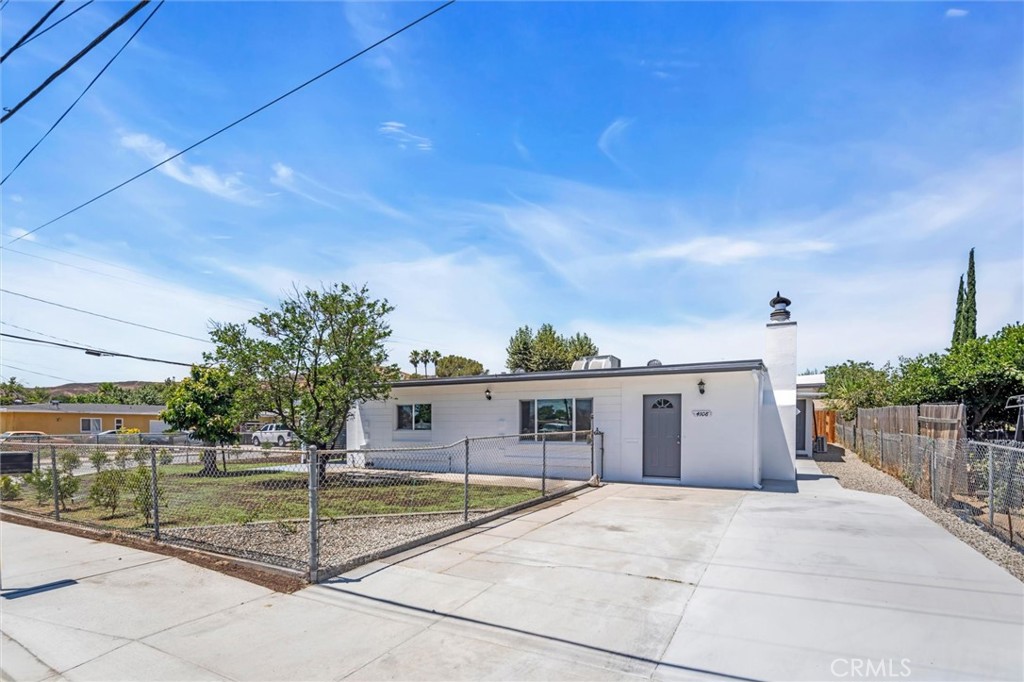 SUPER cute home on a corner lot WITH an attached ADU! This home has been totally remodeled with all the modern finishes and colors, yet still retaining the mid-century vibe, ready for your move in. The main home is approx. 1500+ sq ft, 3 bed 2 bath, fireplace, central heat and air and huge laundry/utility room. The ADU is 700 sq ft with 1 bedroom and 1 bathroom, living room, full kitchen and private laundry/utility room, separate heating/cooling and private entrance. There are 2 driveways on either side of the property for separate parking areas and an attached oversized 2 car garage with extra storage. This property would be perfect for a multi generational family or used for extra income. Not far from freeways, shopping, dining, medical facilities, places of worship, college, you name it! Schedule you tour today with your favorite REALTOR!
