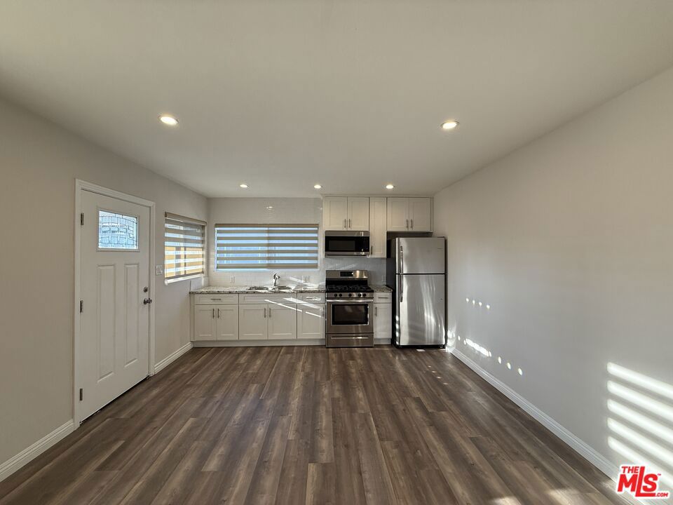 Well maintained 3 bedroom/2 bathroom unit on the grand floor. Appliances include stove, microwave and refrigerator. The asking price includes additional $100 per month for assigned parking space.