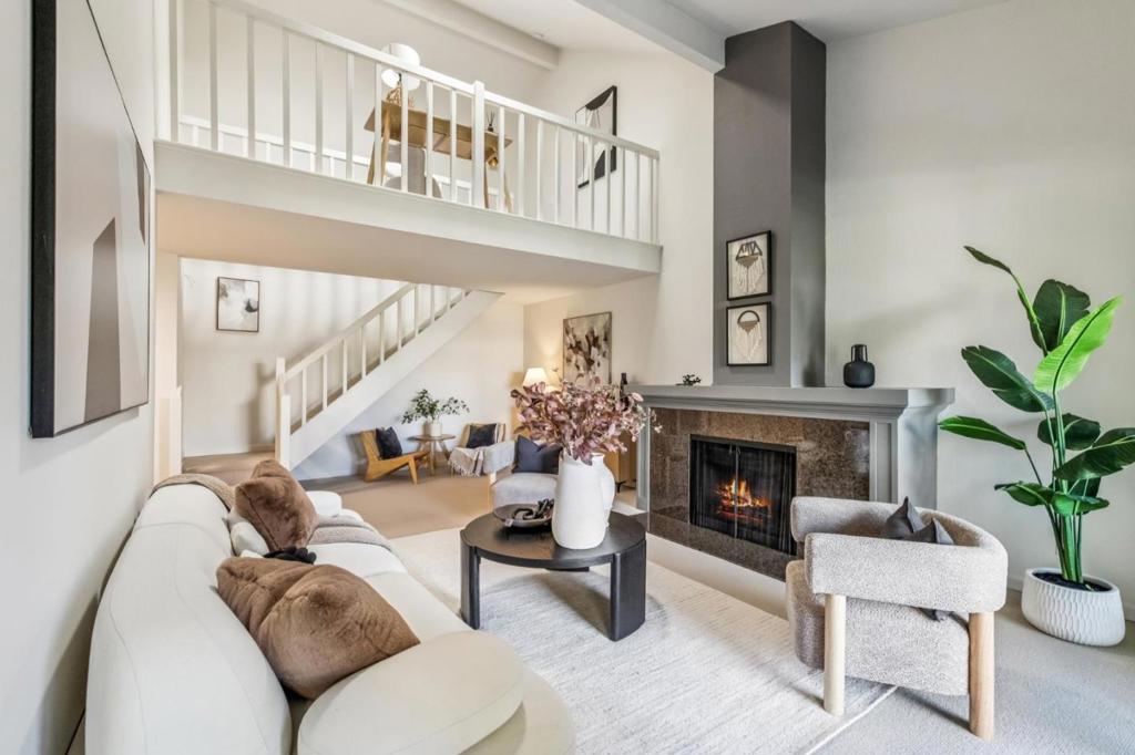 Beautifully updated 3BR/3BA townhome in a central Mountain View location within the desirable Los Altos High School attendance area. Spacious and light-filled with soaring ceilings, abundant windows, and fresh paint and carpet throughout. Remodeled kitchen features granite countertops and quality cabinetry. Flexible floor plan offers two en suite primary bedrooms, ideal for privacy or guests. Enjoy a private, oversized balcony perfect for al fresco dining and relaxation. Additional features include detached garage parking and access to a community pool. Close to Google, Permanente Creek Trail, parks, shopping, and dining.