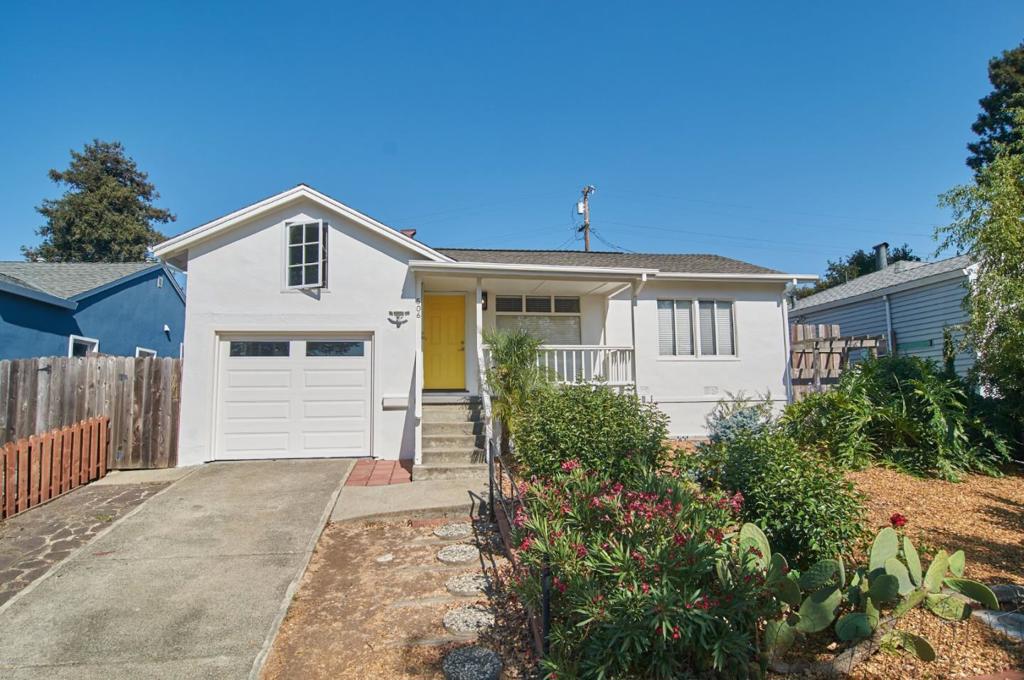 Welcome to this charming 2-bedroom, 1-bathroom home nestled on a hilltop in the vibrant city of Vallejo. Spread across 848 sq. ft., this well maintained residence offers a blend of comfort and functionality. The kitchen is a highlight, featuring granite countertops with decorative backsplash, a suite of appliances including a microwave, oven range - gas, refrigerator, and dishwasher, complemented by a hood over the range. The living space is enhanced by real oak hardwood flooring throughout, which adds a touch of elegance and warmth in the expansive living room and dining area that serves as a centerpiece for your gatherings. Both bedrooms open adjacent to the hall bathroom, adorned with glass enclosed shower over bathtub and tile floors. Laundry is conveniently located in the insulated garage, where you'll also find one garage space and stairs up to a 12x12 carpeted sleeping loft. French doors open to lattice covered deck with wooden bench seats in retreat like private backyard with insulated artist studio ideal for ADU conversion and an 8x8 windowed shed offering extra creative space. Apple, pear, fig, lemon, plum trees and many more. Convenient to ferry across to San Francisco and to neighborhood shops and freeways. Welcome home to pride of ownership in a dynamic neighborhood.