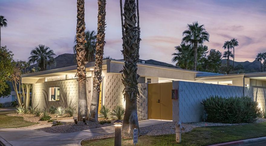 Your modernist dream home awaits in this gorgeously remodeled, 2bed/2bath, at the coveted Seven Lakes Country Club! Originally designed by Richard A. Harrison, inside its shadow-blocked walls, this spacious unit is freshly redesigned for today's living. Spread out over the 1,545 sq ft open floor plan, highlighted by large format tile floors, and get ready to entertain in style! The new kitchen is finished with custom Italian cabinetry, and high end appliances including a commercial grade, paneled Fisher & Paykel refrigerator, a wine fridge, plus a large breakfast bar. Walls of glass sliders open out onto a green leisure terrace with views of the mountains and the iconic Southridge estates. Enclosed for maximum privacy, the northern window wall opens onto a large private courtyard, sited to include wraparound mountain views and lined with a desertscaped perimeter garden. Both spacious bedrooms offer sleek custom closets, as well as walk in rain showers in both beautiful baths. The tranquil pool is just steps away.  Past the 24-hour guarded gate, 'The Gem of the Desert' offers a unique elevated lifestyle with its Ted Robinson-designed 18-hole executive golf course, 15 pools and spas with poolhouses, and the lively William Cody designed clubhouse waiting to welcome you to its formal dining room, casual cocktail lounge, and a terrace overlooking the waterfall-fountain. Welcome home!