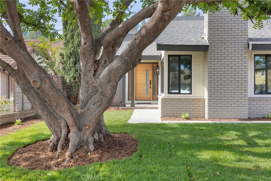 Experience modern single-level living in this beautifully reimagined 3-bedroom, 2-bathroom home located in one of Fullerton’s most sought-after neighborhoods, served by the highly regarded Placentia-Yorba Linda Unified School District. Step inside to a bright, open-concept floor plan where every detail has been thoughtfully curated. The kitchen is the centerpiece, featuring brand new white shaker cabinetry, quartz countertops, stainless steel appliances, and a bar area with a beverage fridge, perfect for entertaining. Throughout the home, you’ll find wide-plank white oak laminate flooring, new Milgard windows, and shaker interior doors that create a cohesive, modern aesthetic. Both bathrooms have been fully updated with new tile, vanities, fixtures, and finishes that exude designer quality. The transformation extends beyond the interior, with fresh exterior paint, a modern front door, new irrigation system, and updated landscaping and hardscape that provide impressive curb appeal. Mechanical upgrades include a new water heater and an overhauled central HVAC system for year-round comfort. Set on a generous 7,762 square foot lot, the property offers ample outdoor space for gatherings, play, or future expansion. With its turnkey condition, desirable school district, and timeless finishes, 2725 Deerpark Drive offers the perfect blend of comfort, style, and convenience.