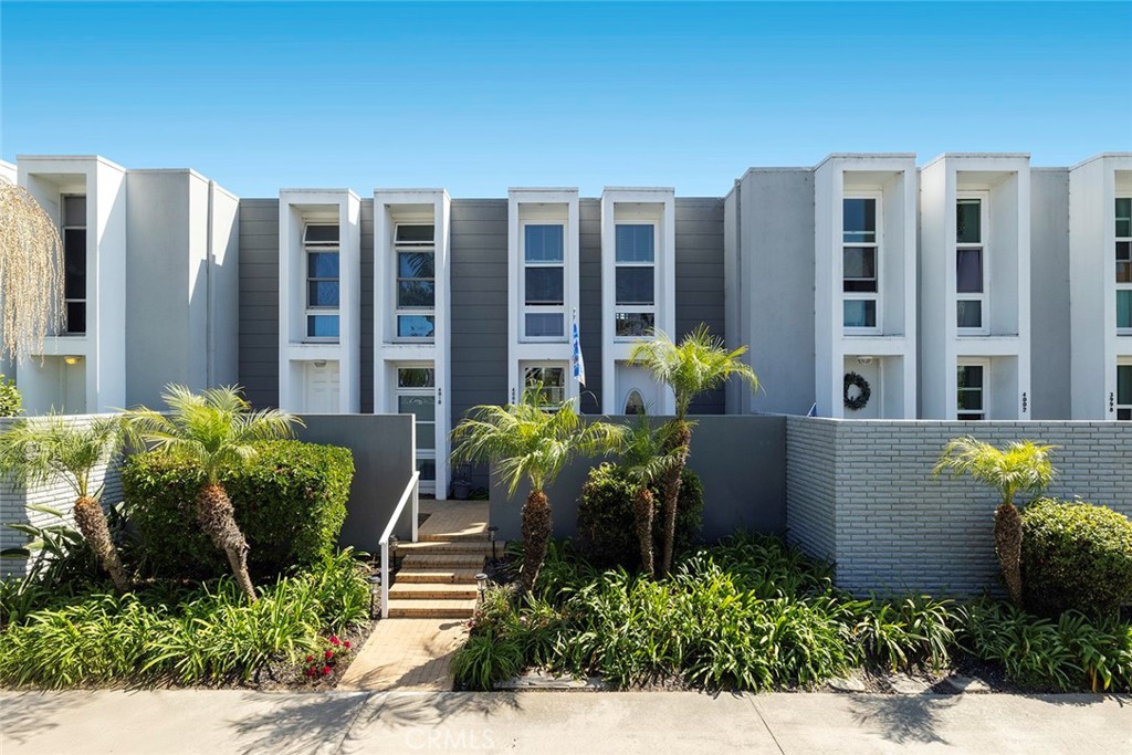 One of a small collection of sought-after residences within Huntington Harbour’s Weatherly Bay. Desired for its exceptional wide waterway location and ideal proximity to the region’s finest amenities, culture, the picturesque wetlands, and iconic beaches – this waterfront community affords abundant lifestyle opportunities. The remodeled townhome comprised of two bedrooms, three baths, and spacious living areas complemented by abundant light through floor-to-ceiling windows and walls of glass – along with an assemblage of delightful appointments. A small selection includes custom cabinetry; quartz surfaces; Viking five-burner gas range, dishwasher, microwave, wine refrigerator, and built-in refrigeration; interior laundry; a spa-like primary suite bath with a walk-in shower and jetted tub; direct garage access; and secluded exterior space fitted with a 10’ motorized shade structure. Further distinguishing the offering – a sparkling waterside pool, recreation areas, tennis courts, and a private boat dock.