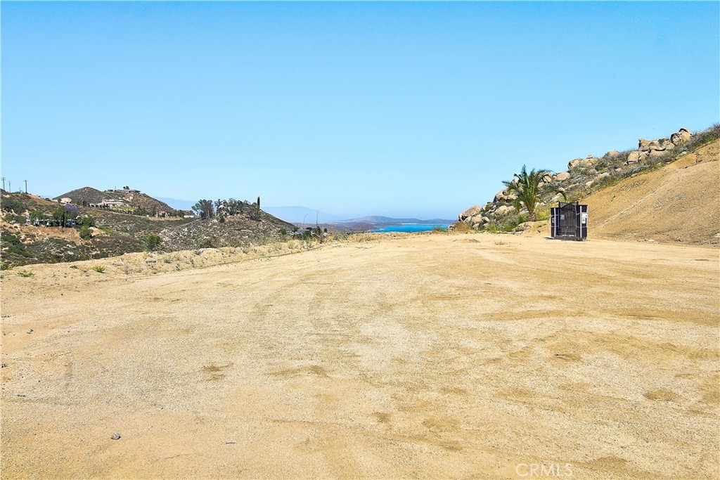 Nestled in the tranquil community of Lake Mathews, this stunning 3.25-acre lot offers breathtaking lake views and is perfectly positioned on a peaceful cul-de-sac. Fully graded and ready for construction, the property comes equipped with an installed water meter, and the permit, design, and perk test for a septic system have already been paid for—saving valuable time and effort in the building process. Available with the sale are beautifully designed custom home plans, featuring nearly 3,400 square feet of living space, 3 spacious bedrooms, 3.5 bathrooms, and a generous 3-car garage. This is a rare opportunity to build your dream estate in a private, picturesque setting while still enjoying convenient access to major freeways, shopping, and top-rated schools. Don’t miss the chance to own this exceptional piece of land in one of Riverside County’s hidden gems. Please note that there is no home currently on the property.