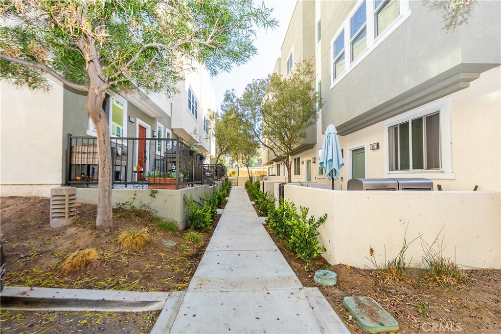 Welcome to 13219 Shaw Lane, a stylish tri-level modern townhouse located in the highly desirable Tovara Homes community of Sylmar. This home offers approximately 1,790 square feet of thoughtfully designed living space, featuring four bedrooms and four bathrooms, including a convenient downstairs bedroom perfect for in-laws, parents, or guests. The open and inviting floor plan showcases a contemporary kitchen with quartz countertops, upgraded finishes, and abundant cabinetry, while the spacious primary suite offers a private bath and generous closet space. Additional highlights include a tankless water heater, central HVAC, and an attached two-car garage with EV-ready potential. Set within a gated community with a low monthly HOA, this residence is ideally located near shopping, dining, parks, schools, and major freeways, offering the perfect blend of modern design, comfort, and convenience.